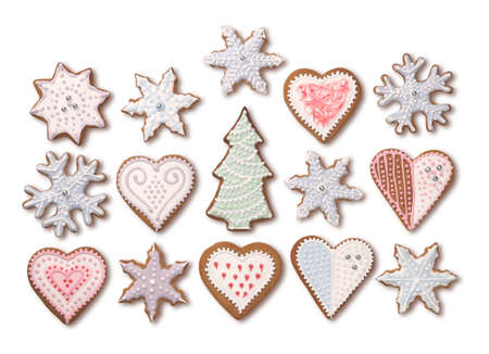 Sweet Christmas gingerbread cookies collection with colorful sugar icing decoration, isolated on white backgroundの写真素材