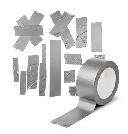 Duct tape roll silver repair reel and different tape ribbons isolated, DIY fixing and improvement conceptの写真素材