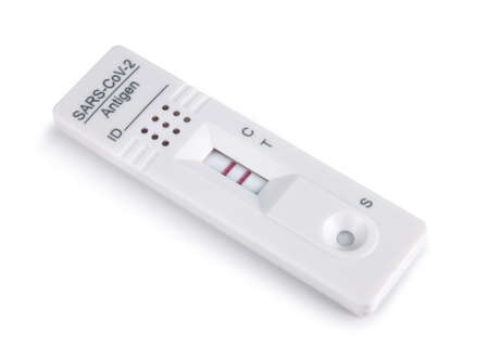 Covid-19 corona virus antigen test kit cassette device showing positive result, isolated on white backgroundの写真素材