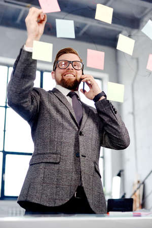 mid age businessman working on new project at modern office