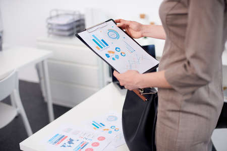 Mid age businesswoman working at the officeの写真素材