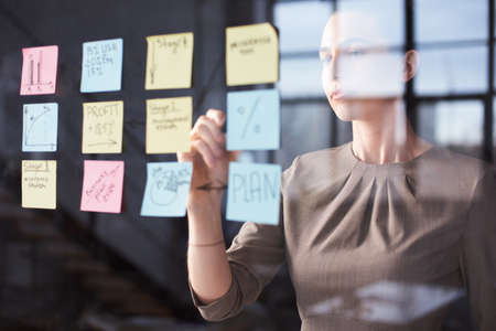 mid age businesswoman working on new project at modern office