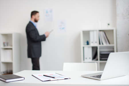 mid age businessman working on new project at modern office