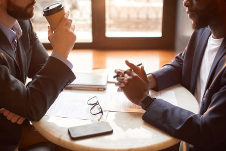Two businessmen have a construction contract for a business lunchの写真素材
