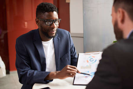 Two businessmen discussing needed changes in the project.の写真素材