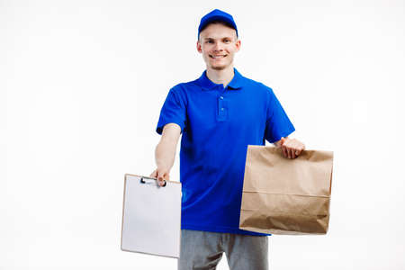 Delivery guy waiting for the client to recieve a shipment.の写真素材