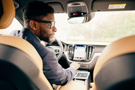 Driver looking at other cars out of the window.