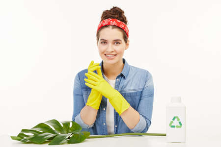 Beautiful woman in her work-wear sits at the table.