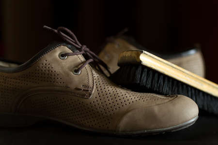Brush and leather shoes. Shoe Care.の写真素材