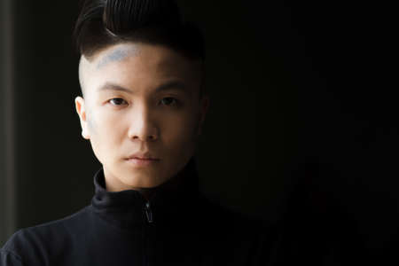 Stylish man in turtleneck. Black background.の写真素材