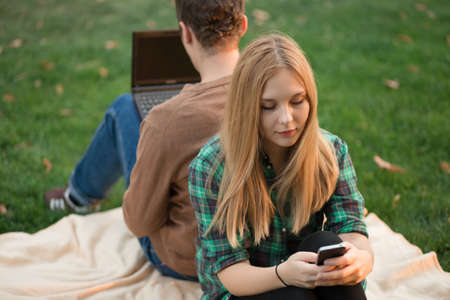 The couple quarreled. Sit back together.の写真素材