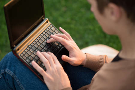 Man's hands to print text on the keyboard