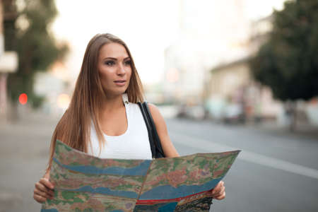 Young woman watching the city map