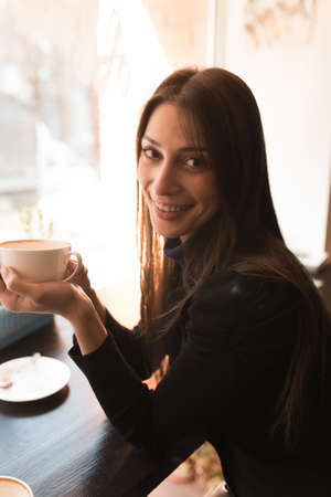 Portrait of woman in coffee shop