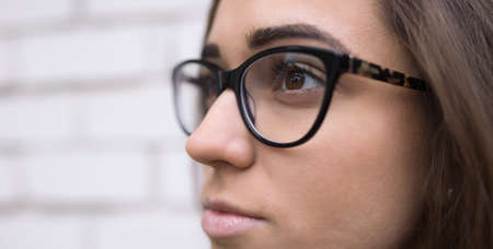 Close up of a young woman wearing glassesの写真素材