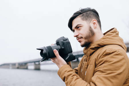 Photographer take picture in open space at riverの写真素材
