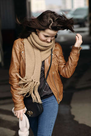 Young beautiful girl walking on roof of parking