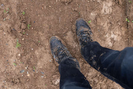 Shoes in dirt. Hard hiking.の写真素材
