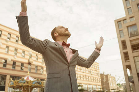 Businessman celebrating a success in an urban settingの写真素材