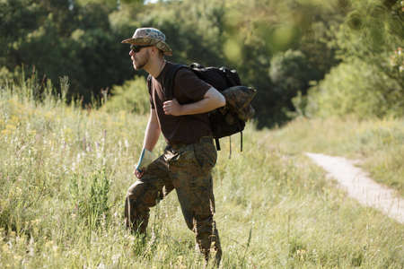 Male tourist walking alone outdoorの写真素材
