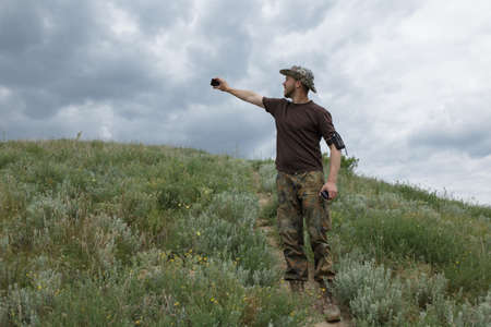 Traveler man taking selfie in fieldの写真素材