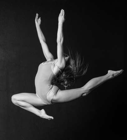 Woman dance posing unusuallyの写真素材