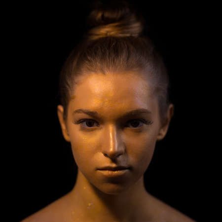 Creative art makeup - bronze woman face closeupの写真素材