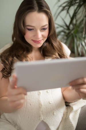 Woman exploring the wealth of online information on pregnancyの写真素材