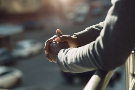 Cropped shot of african american male hands together in city