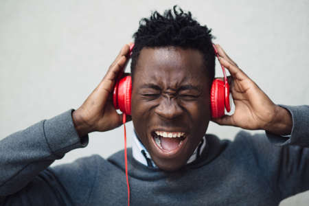 Closeup portrait of african american man enjoy to listening music with headphones