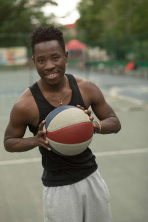 Portrait of african american man on basketball court keep ballの写真素材