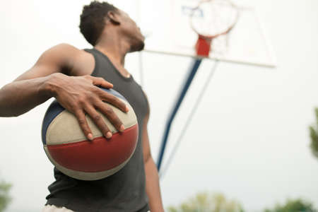 Portrait of african american man on basketball court keep ballの写真素材