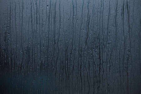 Wet window with drops of water