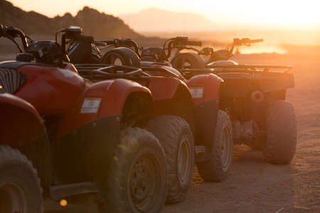 A lot of ATV in sunrise beam in Egypt desert
