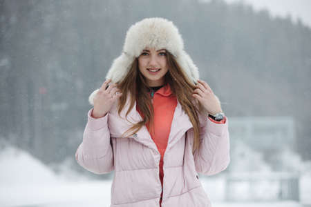 Woman in hat at winterの写真素材