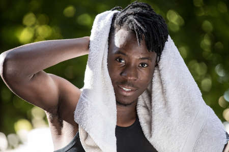 African man portrait with towel on a head, beauty conceptの写真素材