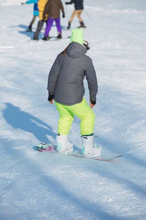 Winter sport activity, people skiing, rear viewの写真素材