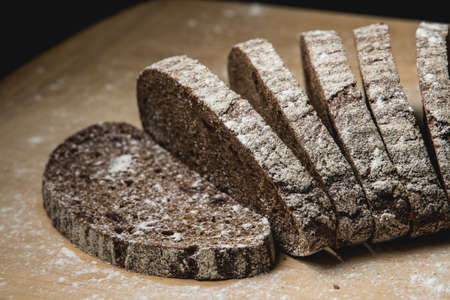 Black bread on the wooden deskの写真素材
