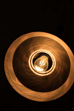 Orange round chandelier with a lampの写真素材