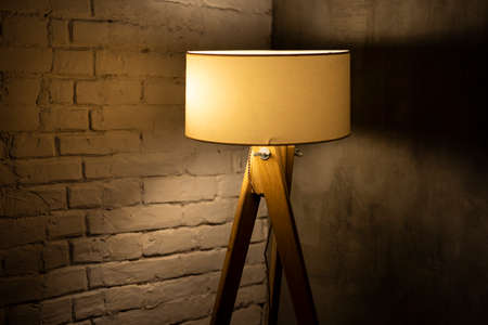 Old lamp shining in the room corner