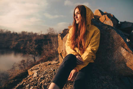 Traveler woman portrait sitting on the nature near quarryの写真素材