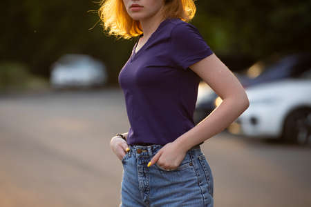 Woman in blank violet shirt mockup