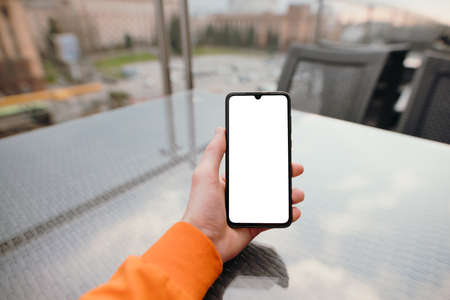 Smartphone with empty screen in a male hand