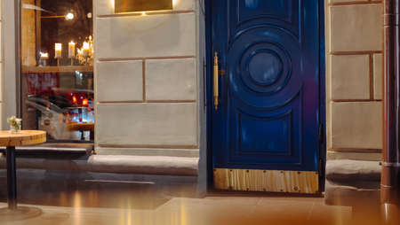 Vintage blue door entrance into cafe or restaurant