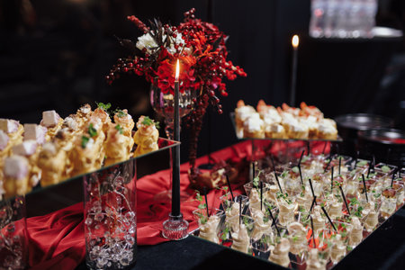 A buffet at the event with red decorの写真素材