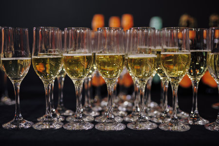 A row of champagne on the table at eventの写真素材