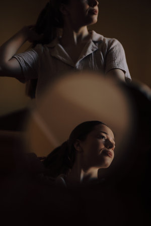 Creative double portrait of woman in a mirrorの写真素材