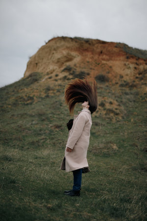 Woman toss her hair at the nature, slow motionの写真素材