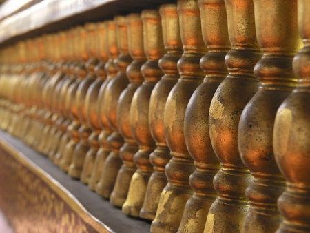 The perspective of golden balusters in the temple of Thailandの写真素材