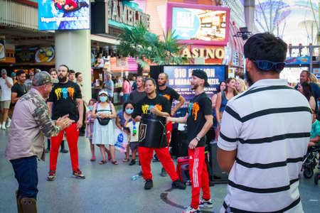 Performers singing and people clapping on Fremont Street